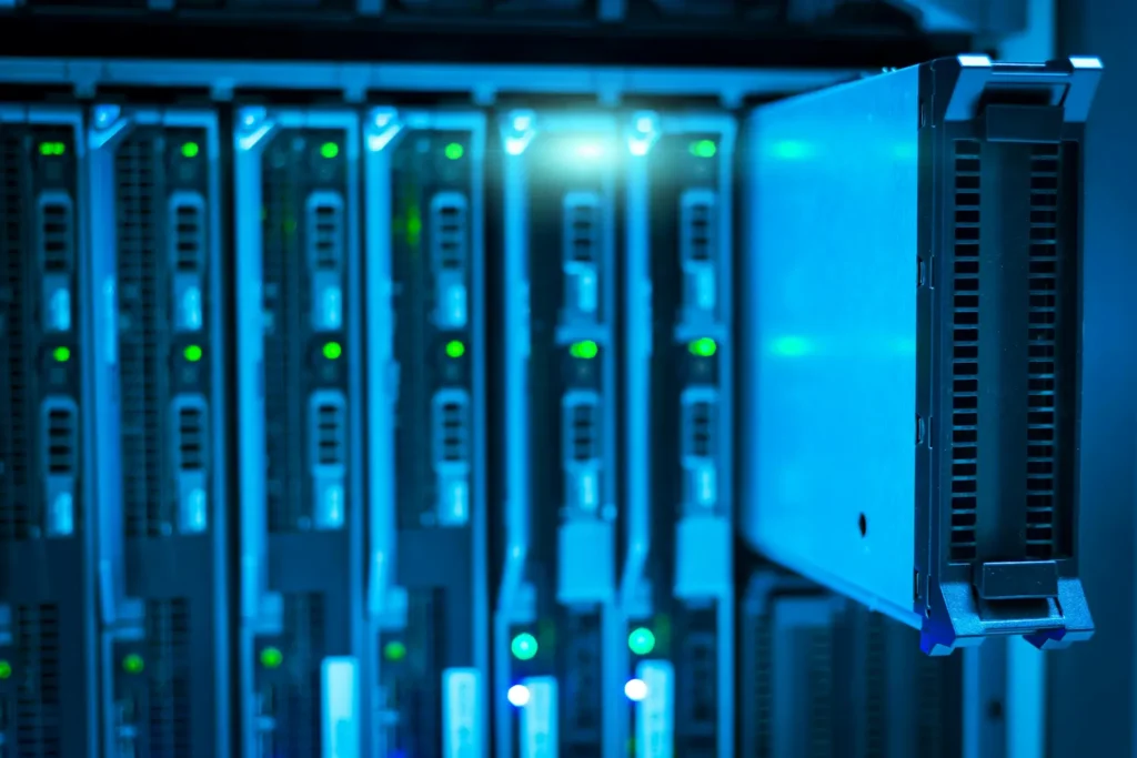 Modern data center hardware representing Microsoft Azure managed services, showing a server module being serviced in a high-density rack.